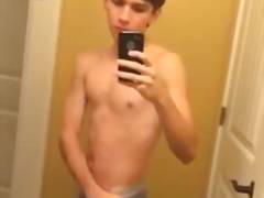 Boy undressing in front of mirror